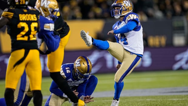 Dec 12, 2021; Hamilton, Ontario, CAN; Winnipeg Blue Bombers kicker Sergio Castillo (14) kicks a field goal during the first half against the Hamilton Tiger-Cats in the 108th Grey Cup football game at Tim Hortons Field. Mandatory Credit: John E. Sokolowski-USA TODAY Sports  